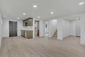 Kitchen with recessed lighting, light countertops, and light wood-style floors