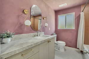 Full bath with vanity and shower / bath combo with shower curtain