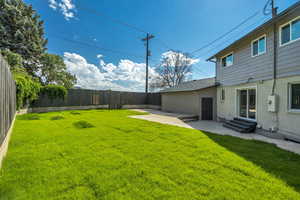 Fenced backyard featuring a patio and entry steps