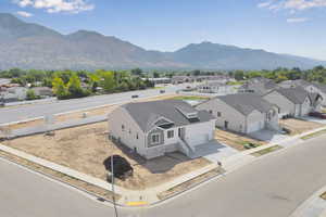 Aerial perspective of suburban area featuring a mountain backdrop