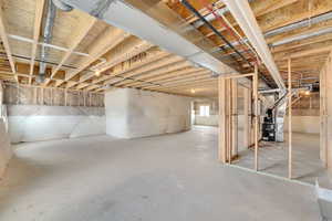 Basement featuring heating unit