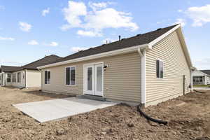Rear view of property with French doors, a patio area