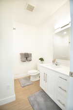 Full bathroom featuring vanity and light wood finished floors
