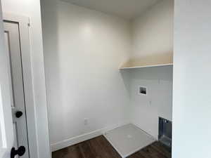 Laundry room with dark wood-style flooring and washer hookup