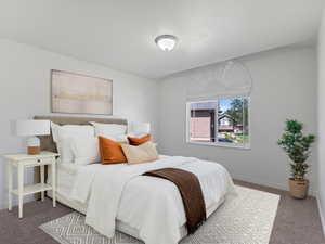 Carpeted bedroom featuring baseboards