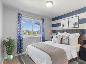 Carpeted bedroom featuring baseboards