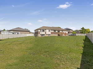 View of fenced backyard