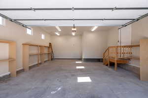 Garage featuring baseboards