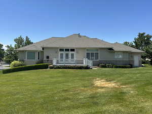 back of house from large grassy area