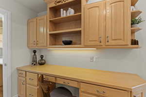 Office area featuring built in desk