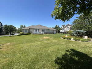 back of house from large grassy area
