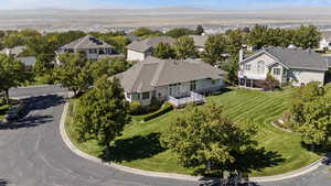 Aerial perspective of suburban area featuring a mountain backdrop