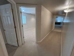 View from Bathroom 2 showing bedroom 1 to the left and doorways into Great Room
