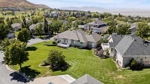 Aerial view of residential area featuring a mountainous background