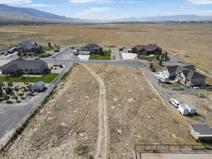 Aerial view of residential area featuring a mountainous background