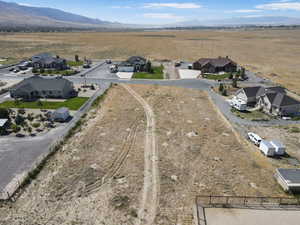 Aerial perspective of suburban area with a mountain backdrop