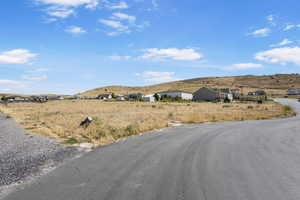 View of asphalt street with a mountain view