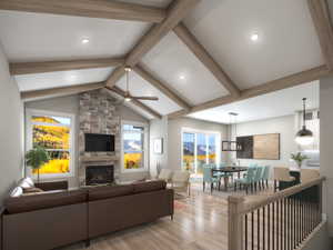 Living room featuring light wood-type flooring, a ceiling fan, a fireplace, and recessed lighting