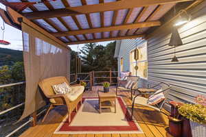 Deck featuring outdoor lounge area and a pergola