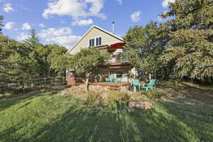 Back of property featuring a deck