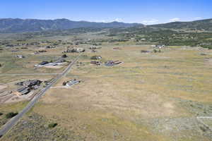 Aerial overview of property's location featuring rural landscape and mountains