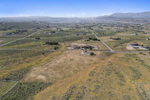 Aerial overview of property's location featuring rural landscape and mountains