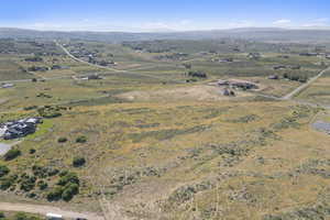 Overview of rural landscape featuring a mountainous background