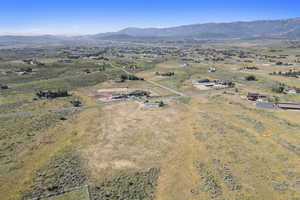 Aerial view of sparsely populated area featuring a mountain backdrop
