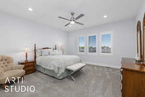 Carpeted bedroom with recessed lighting and ceiling fan
