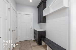 Mudroom featuring light wood-type flooring