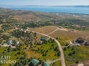 Aerial view of property's location with a nearby body of water