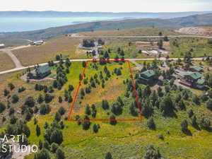 View of rural area with property boundaries highlighted and a mountainous background