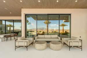 View of patio with outdoor lounge area and a mountain view