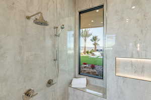 Bathroom featuring a tile shower