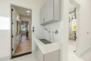 Bathroom featuring recessed lighting and tankless water heater