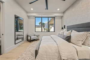 Bedroom with wood finished floors, recessed lighting, and ceiling fan