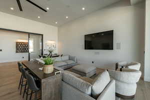 Living area featuring light wood-type flooring and recessed lighting