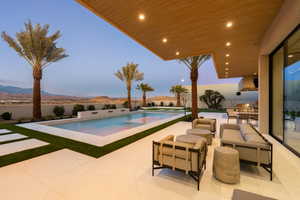 View of swimming pool with a patio, outdoor lounge area, outdoor dining space, and a hot tub