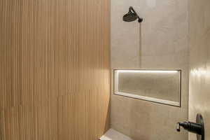 Bathroom view of a tile shower