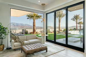 Entryway featuring a mountain view and light wood-style floors