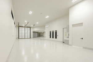 Garage featuring baseboards