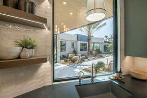 Community lobby with recessed lighting and wood ceiling