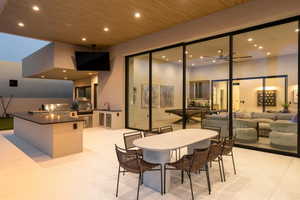 View of patio with area for grilling, outdoor lounge area, and outdoor dining space