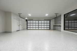 Garage featuring baseboards