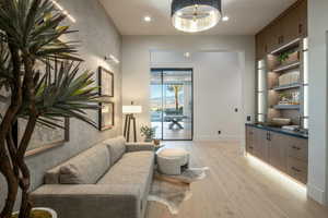Living room featuring light wood-type flooring and recessed lighting