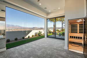 Entryway featuring a mountain view, a sauna / steam room, carpet floors, and recessed lighting