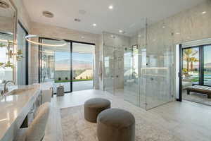 Full bath featuring vanity, a stall shower, and recessed lighting
