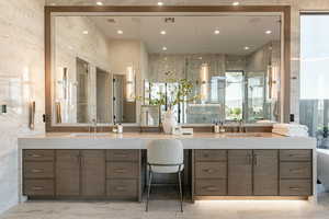 Full bath with vanity, healthy amount of natural light, marble finish flooring, and recessed lighting