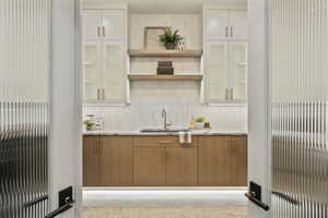 Bar featuring tasteful backsplash