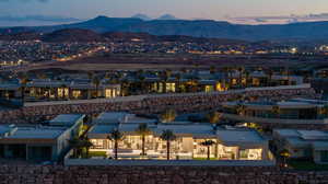 View of back of house at dusk